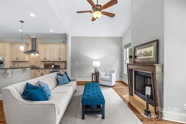 6211 Cruden Bay Way, Charlotte, NC 28277 - living room with light wood-style flooring, a fireplace with flush hearth, a ceiling fan, recessed lighting, and lofted ceiling