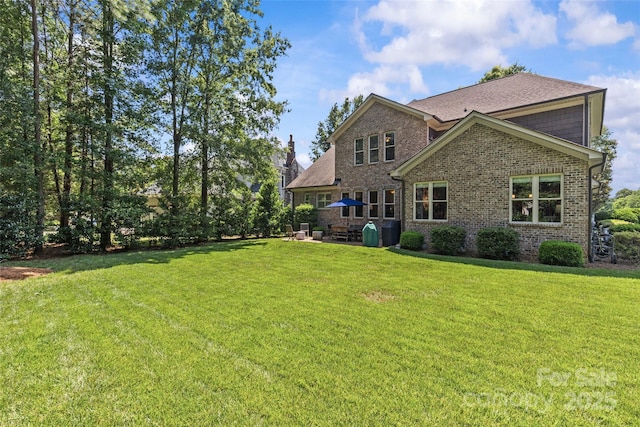 6211 Cruden Bay Way, Charlotte, NC 28277 - rear view of property featuring brick siding, a lawn, and a patio area