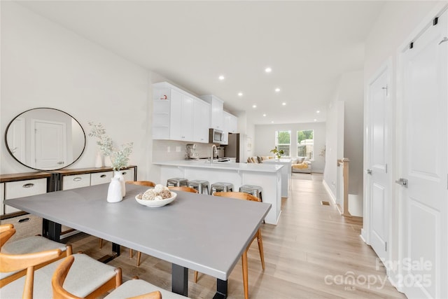 3748 Ellington St, Charlotte, NC 28211 - dining space with light wood-style floors and recessed lighting