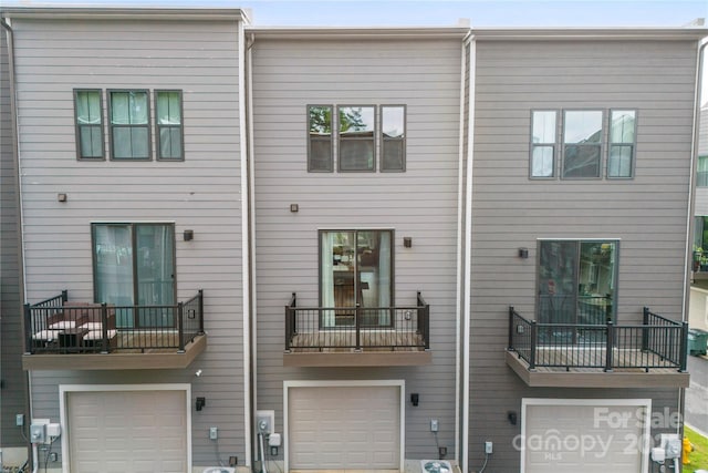 3748 Ellington St, Charlotte, NC 28211 - back of house with a garage, a balcony, and central AC