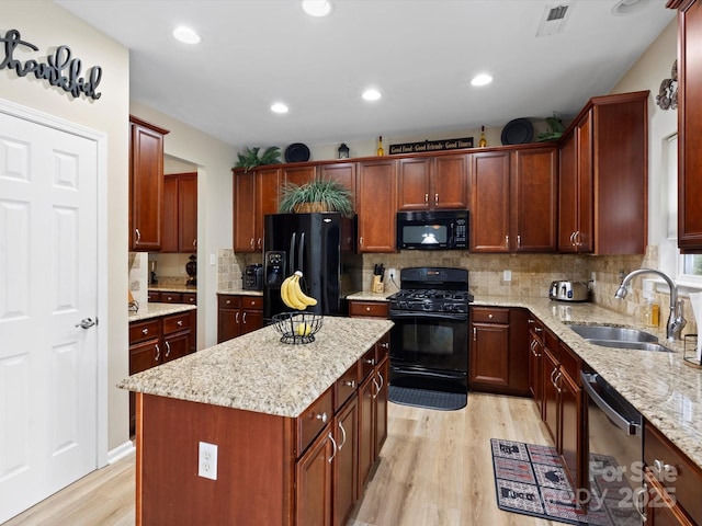 1051 Streamlet Way, Monroe, NC 28110 - kitchen featuring black appliances, a sink, light wood-type flooring, backsplash, and recessed lighting
