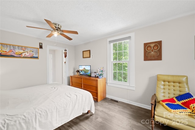 485 Lincoln St, Cramerton, NC 28032 - bedroom featuring wood finished floors, a textured ceiling, crown molding, baseboards, and a ceiling fan