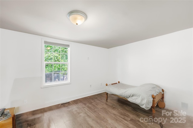 485 Lincoln St, Cramerton, NC 28032 - unfurnished bedroom featuring wood finished floors and baseboards
