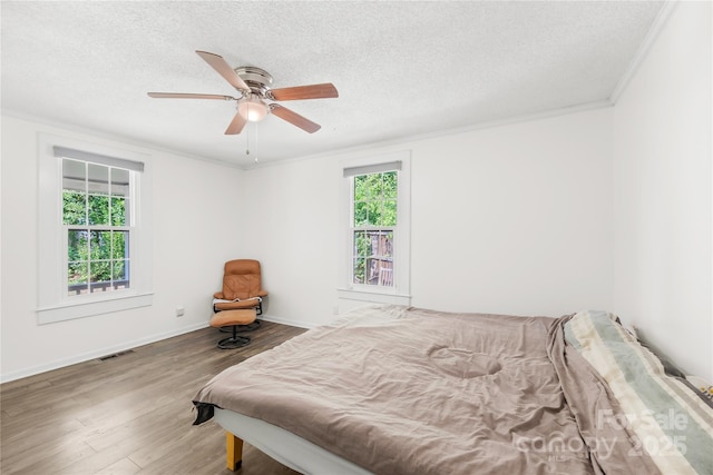485 Lincoln St, Cramerton, NC 28032 - bedroom with crown molding, a textured ceiling, wood finished floors, a ceiling fan, and baseboards