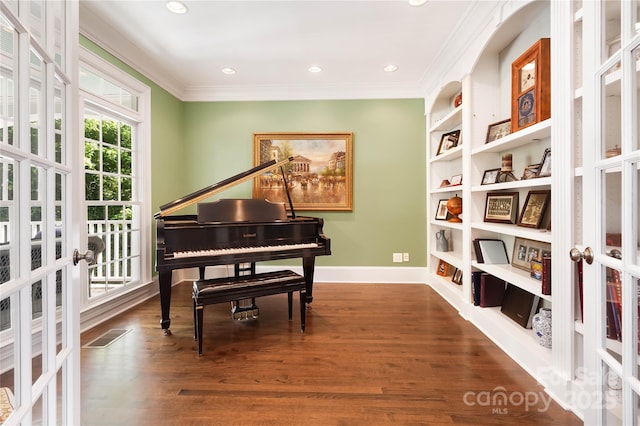 19946 River Falls Dr, Davidson, NC 28036 - living area with french doors, ornamental molding, wood finished floors, baseboards, and built in features