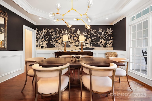 19946 River Falls Dr, Davidson, NC 28036 - dining room featuring ornamental molding, a wainscoted wall, a decorative wall, wood finished floors, and a chandelier