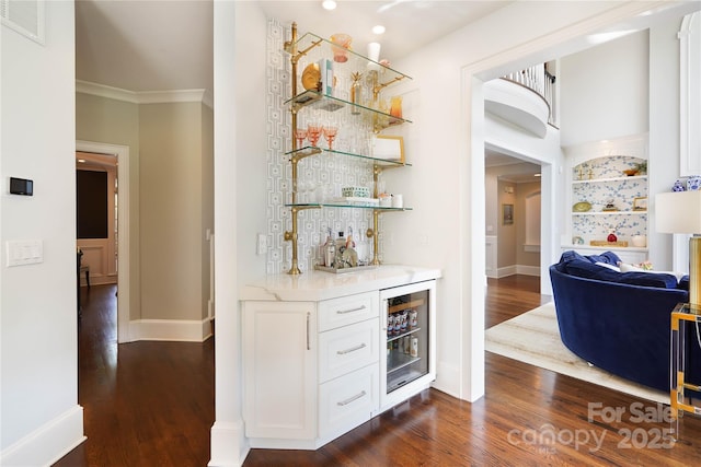 19946 River Falls Dr, Davidson, NC 28036 - indoor dry bar featuring wine cooler, dark wood-style floors, baseboards, crown molding, and recessed lighting