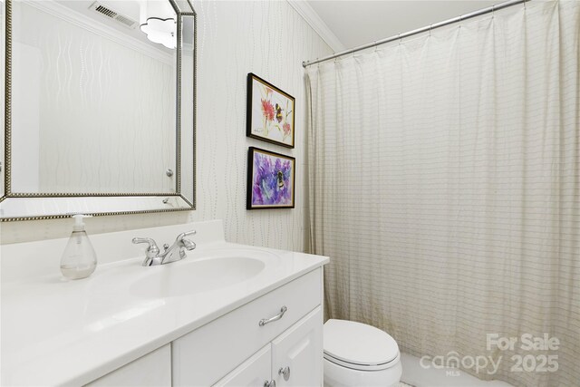 19946 River Falls Dr, Davidson, NC 28036 - bathroom featuring wallpapered walls, ornamental molding, toilet, vanity, and curtained shower