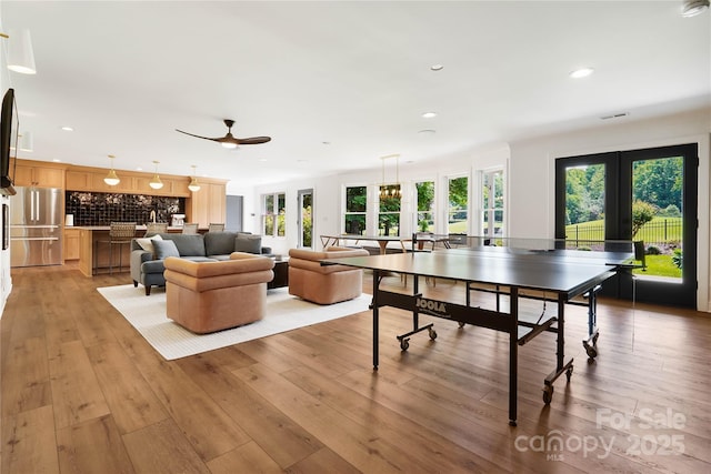 19946 River Falls Dr, Davidson, NC 28036 - rec room featuring french doors, healthy amount of natural light, recessed lighting, and light wood-type flooring