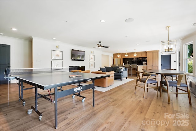 19946 River Falls Dr, Davidson, NC 28036 - recreation room featuring light wood-style flooring, crown molding, recessed lighting, and a ceiling fan