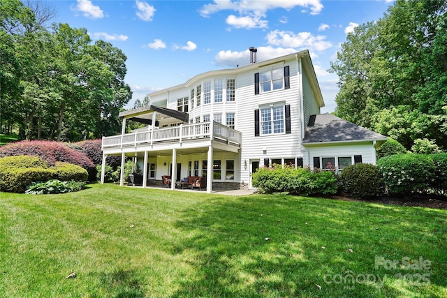 19946 River Falls Dr, Davidson, NC 28036 - back of property with a yard, a patio area, a deck, and a shingled roof