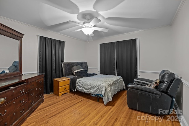363 High St, Polkton, NC 28135 - bedroom with light wood-style flooring, ornamental molding, and ceiling fan
