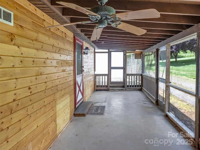 74 Saturn Ct, Clyde, NC 28721 - unfurnished sunroom featuring ceiling fan