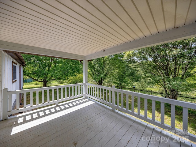74 Saturn Ct, Clyde, NC 28721 - wooden terrace featuring view of scattered trees and fence