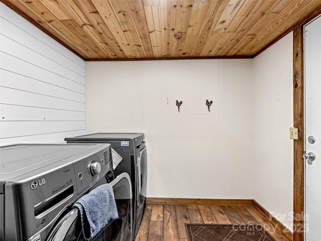 74 Saturn Ct, Clyde, NC 28721 - laundry area featuring washing machine and clothes dryer, hardwood / wood-style floors, wood ceiling, baseboards, and ornamental molding
