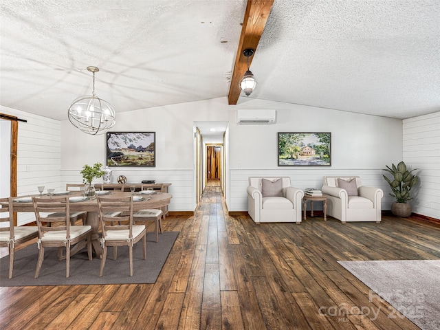 74 Saturn Ct, Clyde, NC 28721 - dining space with a wall unit AC, hardwood / wood-style floors, a chandelier, a textured ceiling, and wainscoting