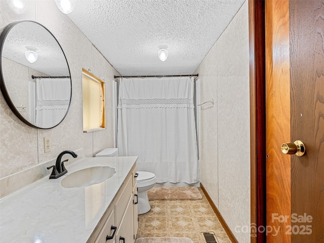 74 Saturn Ct, Clyde, NC 28721 - bathroom featuring a textured ceiling, toilet, and vanity