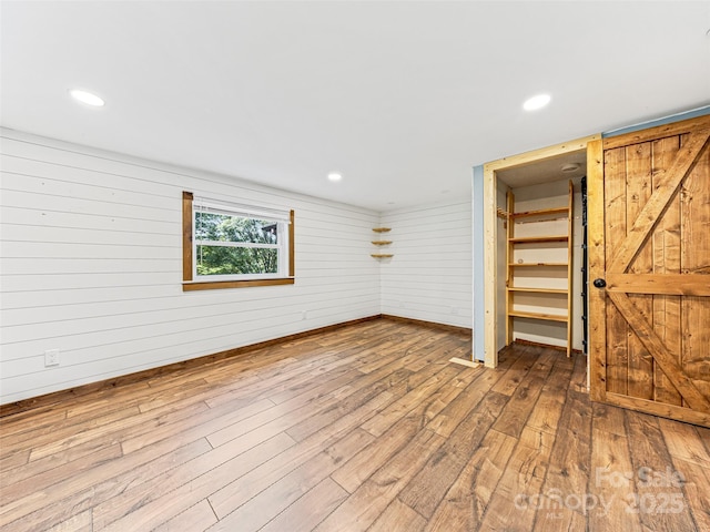 74 Saturn Ct, Clyde, NC 28721 - interior space with hardwood / wood-style floors, wooden walls, recessed lighting, and baseboards