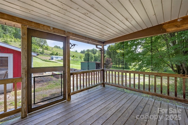 74 Saturn Ct, Clyde, NC 28721 - wooden terrace featuring a storage unit and an outbuilding