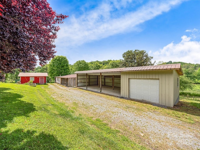 74 Saturn Ct, Clyde, NC 28721 - garage featuring a detached garage and driveway