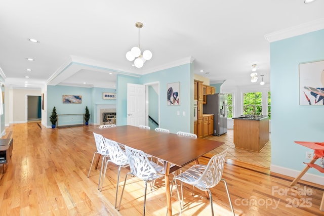 4120 Lake Shore Rd S, Denver, NC 28037 - dining area with ornamental molding, recessed lighting, a fireplace, baseboards, and light wood-style flooring