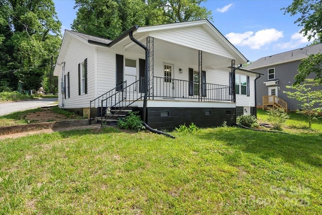1746 2nd Street Pl SW, Hickory, NC 28602 - view of front facade featuring a porch and a front lawn