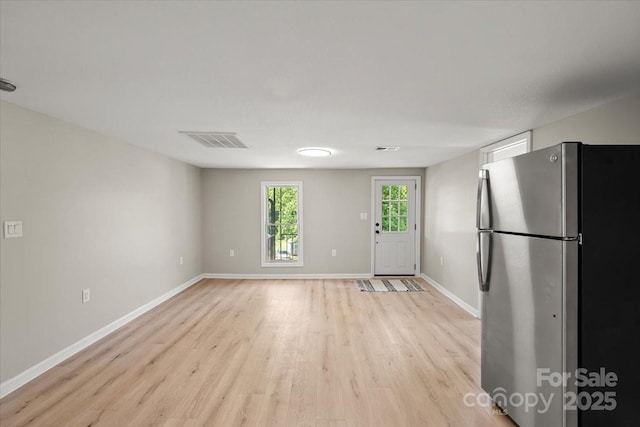 1746 2nd Street Pl SW, Hickory, NC 28602 - kitchen featuring freestanding refrigerator, light wood finished floors, baseboards, and white cabinetry