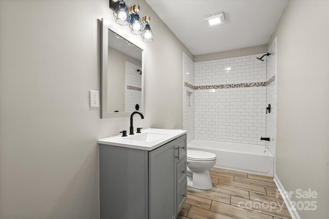 1746 2nd Street Pl SW, Hickory, NC 28602 - bathroom featuring wood finish floors, toilet, vanity, and shower / bathtub combination
