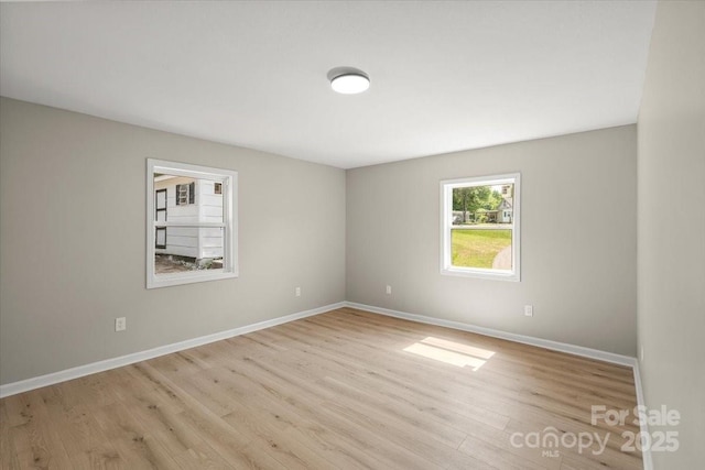 1746 2nd Street Pl SW, Hickory, NC 28602 - spare room with light wood-style flooring and baseboards