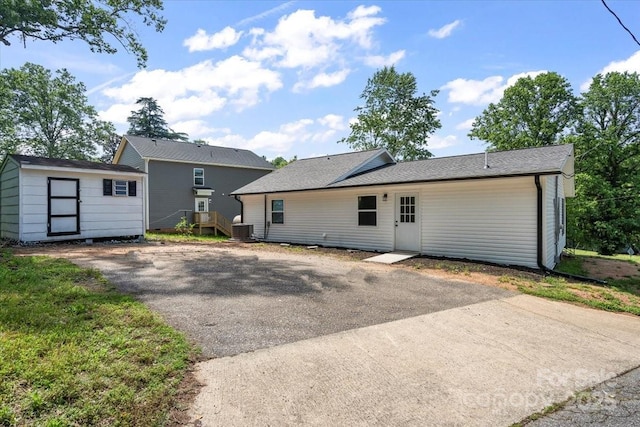 1746 2nd Street Pl SW, Hickory, NC 28602 - rear view of property featuring cooling unit, an outdoor structure, and a storage shed