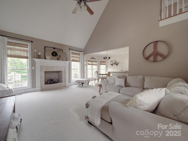1508 Avalon Oaks Ct, Dallas, NC 28034 - carpeted living area featuring high vaulted ceiling, a ceiling fan, a fireplace, and healthy amount of natural light