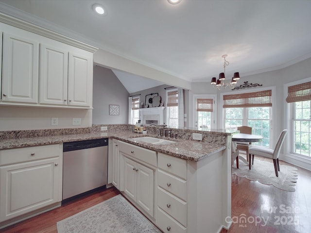 1508 Avalon Oaks Ct, Dallas, NC 28034 - kitchen with dishwasher, a sink, a peninsula, a chandelier, and wood finished floors