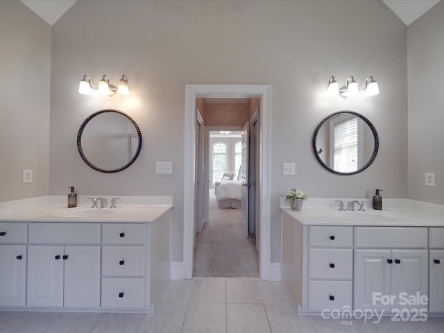 1508 Avalon Oaks Ct, Dallas, NC 28034 - full bath featuring baseboards, lofted ceiling, two vanities, tile patterned flooring, and ensuite bath