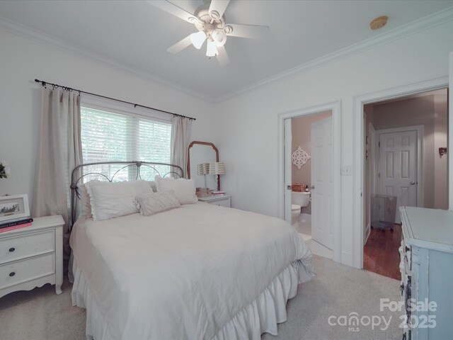 1508 Avalon Oaks Ct, Dallas, NC 28034 - carpeted bedroom featuring crown molding, connected bathroom, and a ceiling fan