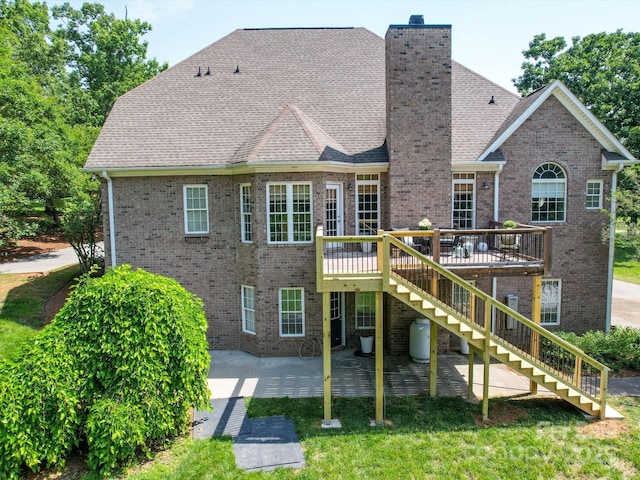 1508 Avalon Oaks Ct, Dallas, NC 28034 - rear view of property featuring stairs, brick siding, a patio, a wooden deck, and a chimney