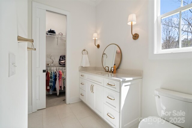 722 Clegg Farm Dr, York, SC 29745 - bathroom with toilet, vanity, tile patterned floors, a spacious closet, and crown molding