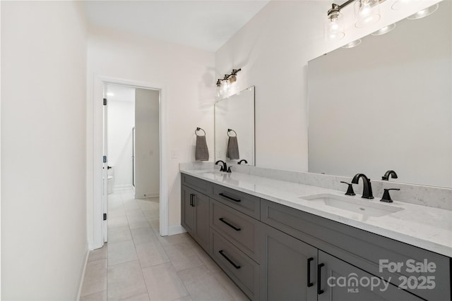 722 Clegg Farm Dr, York, SC 29745 - bathroom featuring double vanity, tile patterned floors, and baseboards