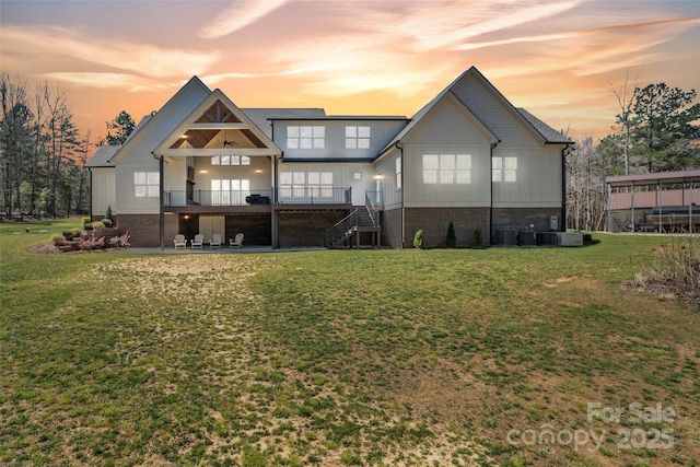 722 Clegg Farm Dr, York, SC 29745 - rear view of house with stairs, a yard, a wooden deck, board and batten siding, and a patio area