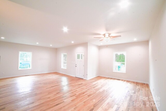 7 Berry Crest Ln, Arden, NC 28704 - spare room featuring plenty of natural light, recessed lighting, light wood-style floors, ceiling fan, and baseboards