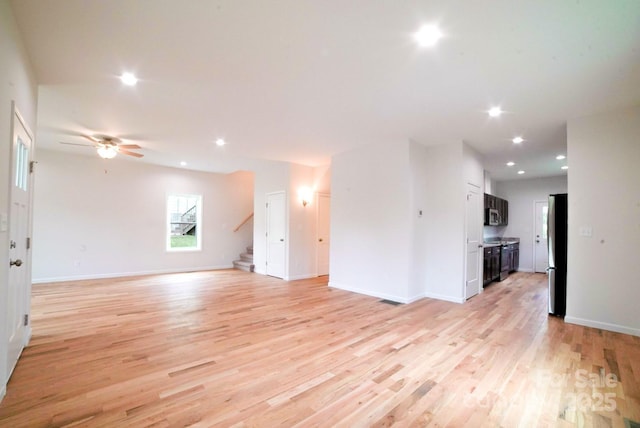 7 Berry Crest Ln, Arden, NC 28704 - unfurnished living room featuring light wood-type flooring, stairway, ceiling fan, recessed lighting, and baseboards