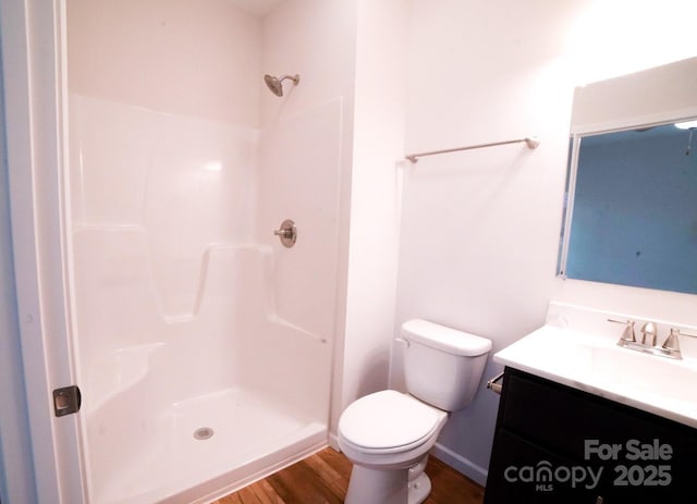 7 Berry Crest Ln, Arden, NC 28704 - full bath featuring a shower, vanity, wood finished floors, toilet, and baseboards