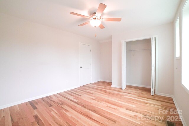 7 Berry Crest Ln, Arden, NC 28704 - unfurnished bedroom with light wood-style flooring, a closet, and baseboards