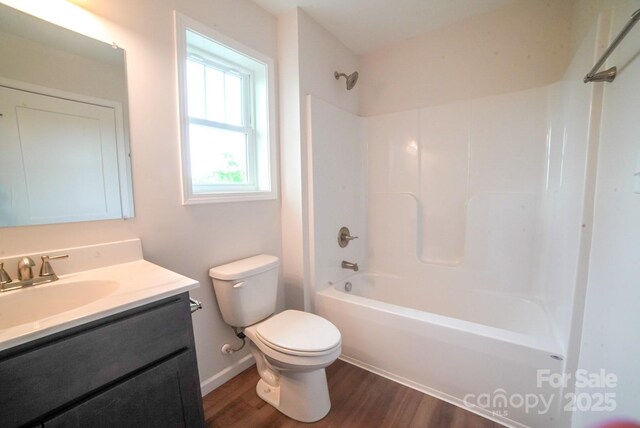 7 Berry Crest Ln, Arden, NC 28704 - full bath with wood finished floors, toilet, vanity, shower / bath combination, and baseboards