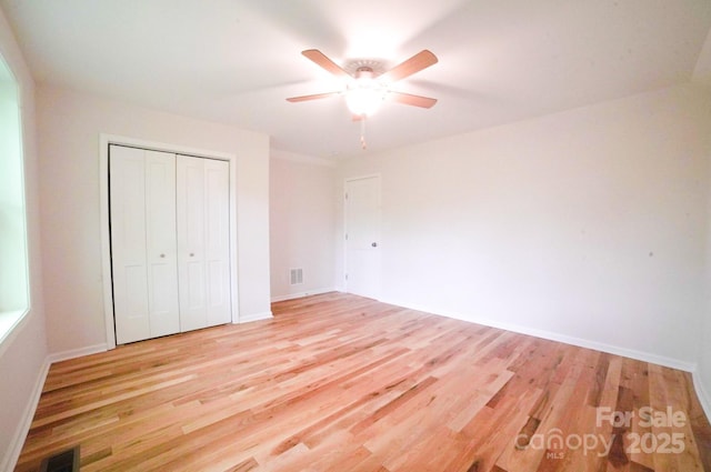 7 Berry Crest Ln, Arden, NC 28704 - unfurnished bedroom featuring light wood-style floors, a closet, and baseboards