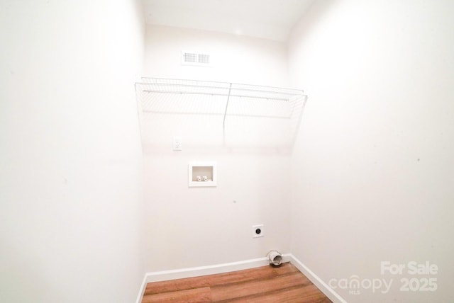 7 Berry Crest Ln, Arden, NC 28704 - laundry room featuring hookup for a washing machine, electric dryer hookup, baseboards, and light wood-style floors