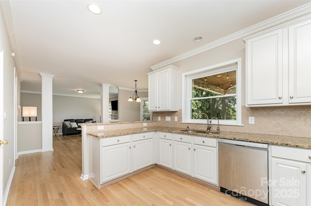 1147 Anduin Falls Dr, Charlotte, NC 28269 - kitchen with dishwasher, a sink, decorative columns, crown molding, and backsplash