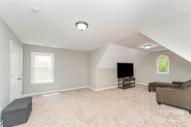 1147 Anduin Falls Dr, Charlotte, NC 28269 - living room with light colored carpet, baseboards, and vaulted ceiling