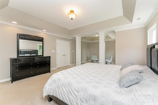 1147 Anduin Falls Dr, Charlotte, NC 28269 - bedroom with decorative columns, a raised ceiling, ornamental molding, recessed lighting, and light carpet
