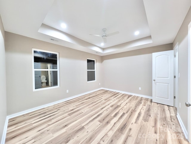 6756 Denver Heights Cir, Denver, NC 28037 - spare room with a raised ceiling, ceiling fan, light wood finished floors, baseboards, and recessed lighting