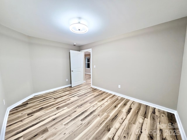 6756 Denver Heights Cir, Denver, NC 28037 - empty room featuring baseboards and light wood-style flooring